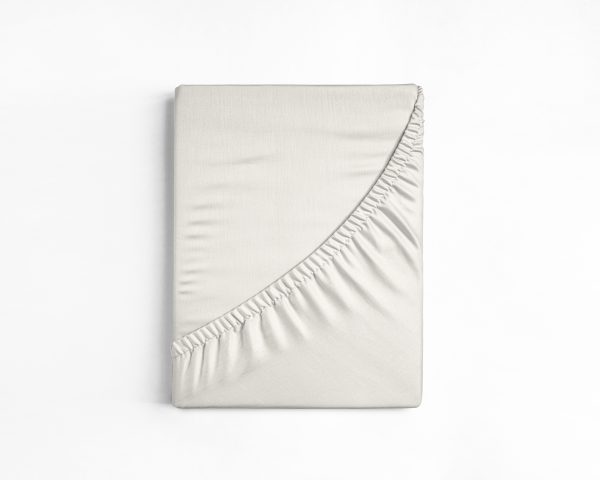 Flat sheet or bed cover folded. White fitted sheet isolated. White sheet with elastic band.